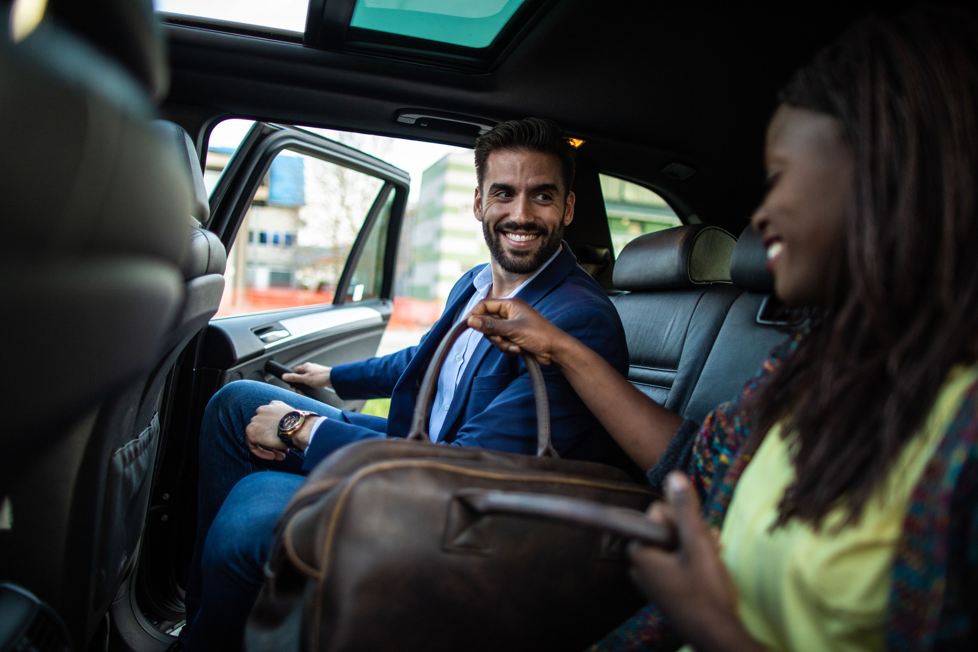 Cheerful friends starting  ride sharing together